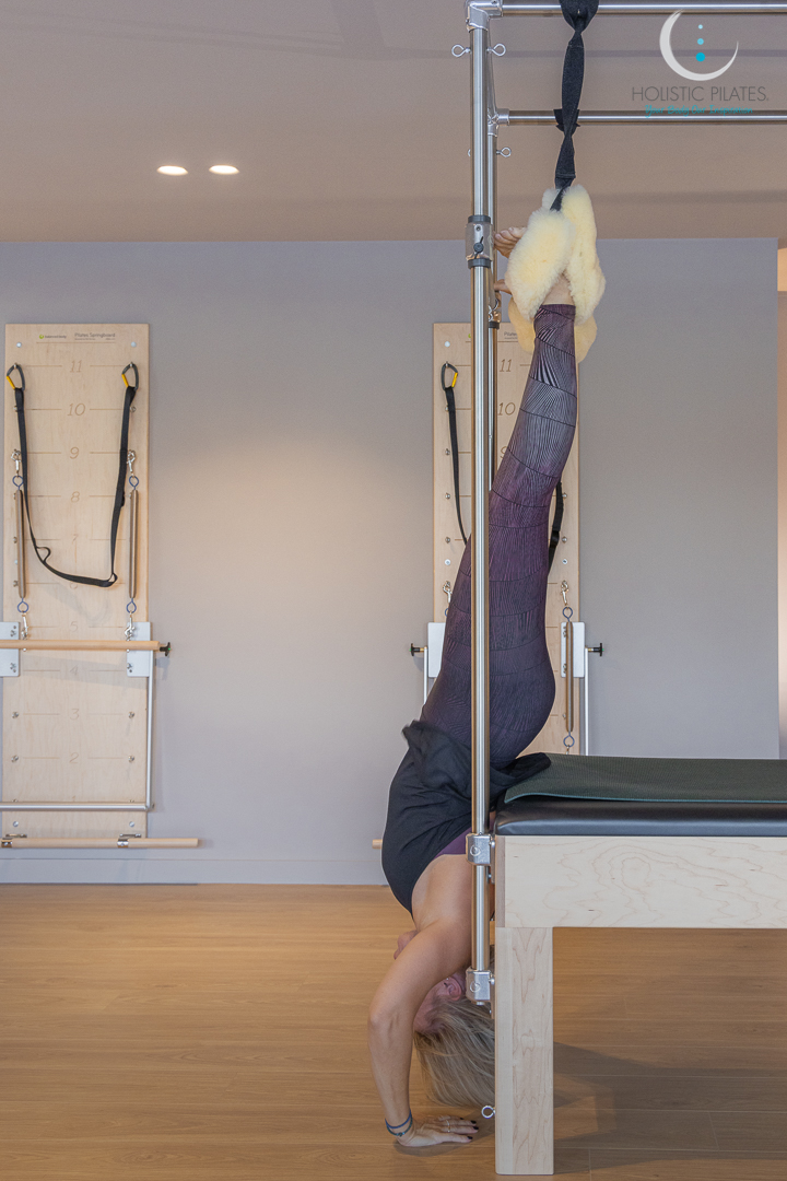 a woman is exerising in our facility with ropes